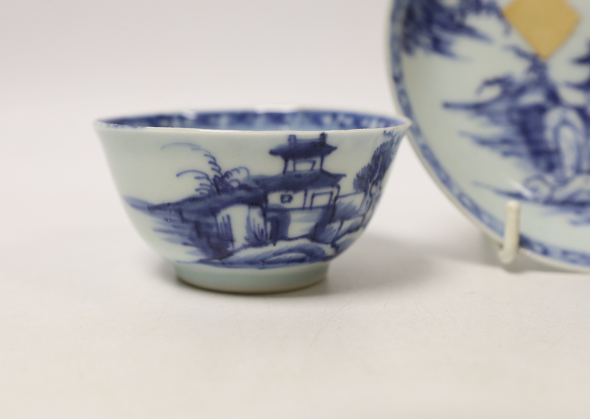 A Chinese Nanking Cargo blue and white saucer and tea bowl, and a Kangxi blue and white tea bowl, largest 11.5cm in diameter